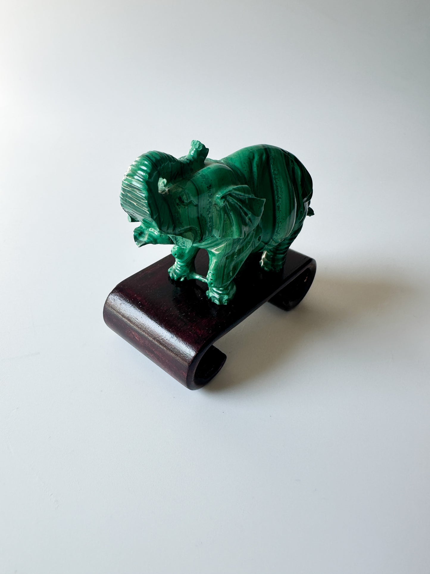 Genuine Malachite Elephant with Wood Stand (2.3125"L x 1"W x 1.75"H)