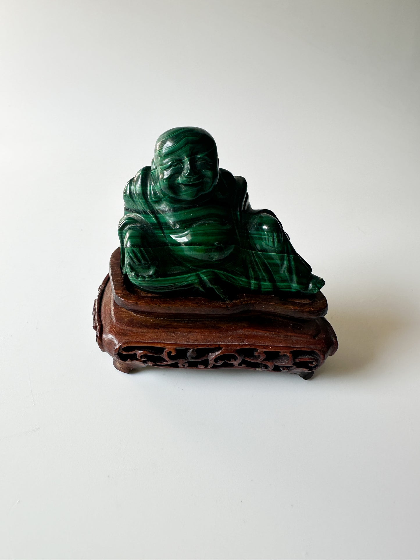 Genuine Malachite Buddha with Wood Stand (2.125"L x 1"W x 1.75"H)