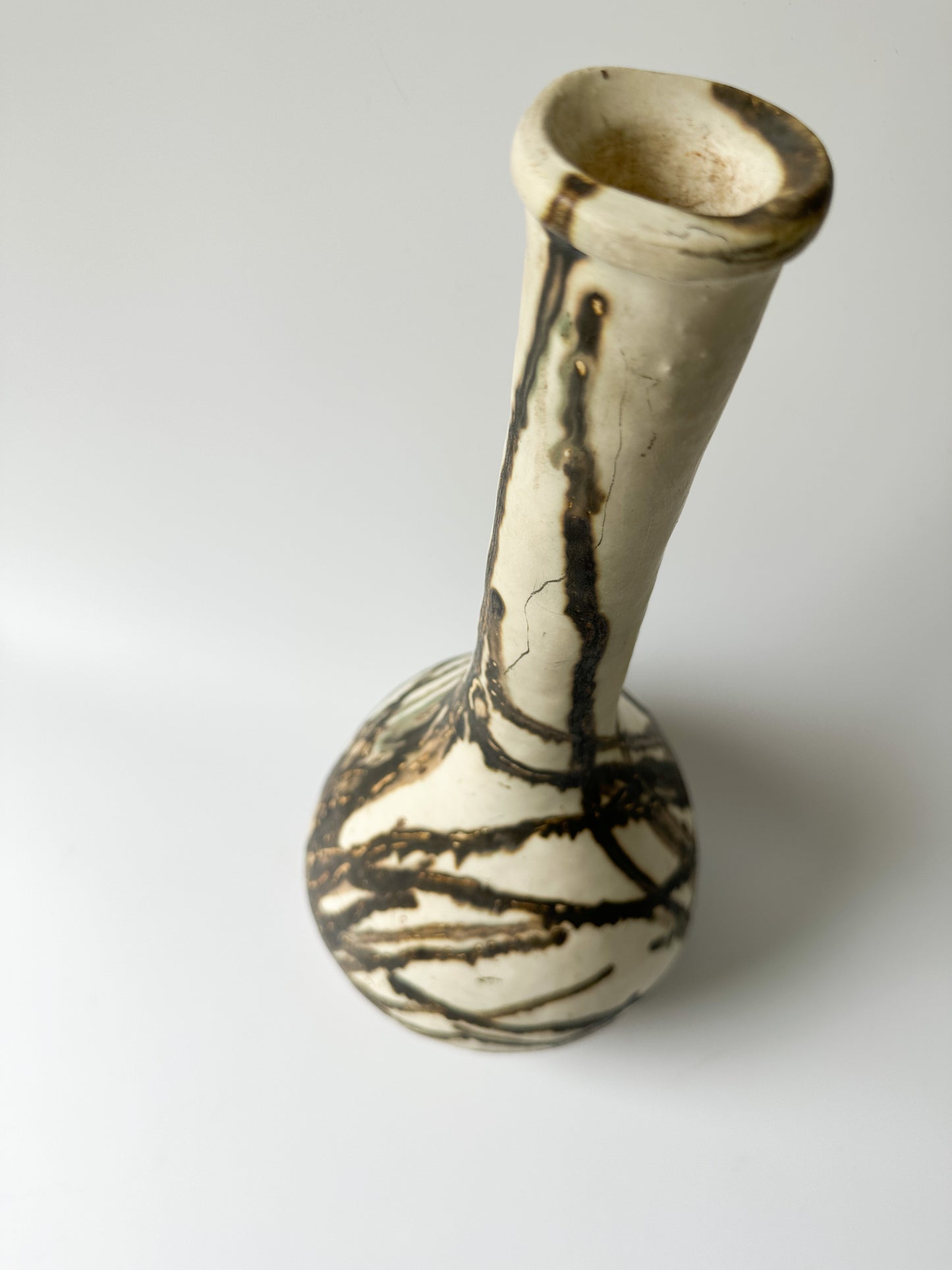 Tall Cream and Black Pottery Vessel