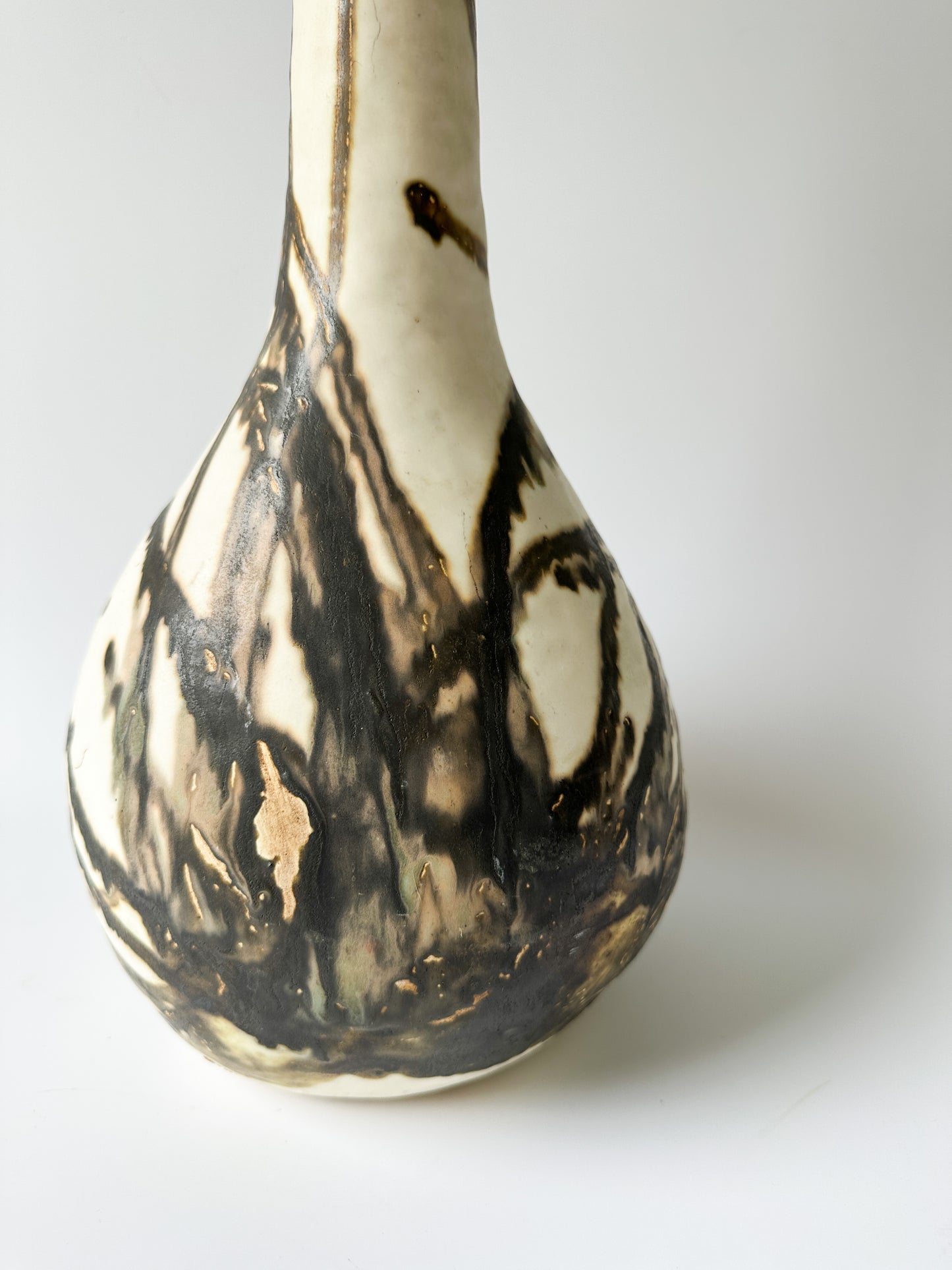 Tall Cream and Black Pottery Vessel